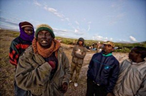 Evicted and upset camp residents in the cold